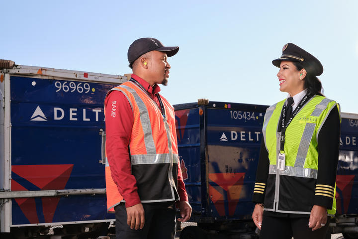 A Delta ramp agent and pilot talk at Hartsfield-Jackson Atlanta International Aiport.