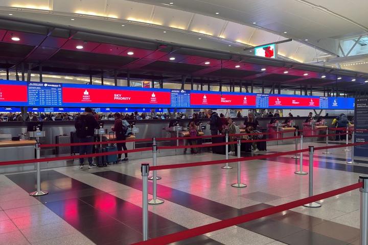 Delta’s signature digital backwall with up-to-date gate information at New York - JFK.