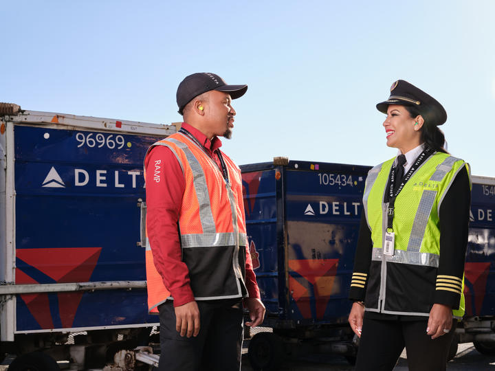 A Delta ramp agent and pilot talk at Hartsfield-Jackson Atlanta International Aiport.